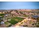 Serene aerial view showcasing the neighborhood, outdoor lounge, and meticulously manicured lawn at 12295 Skyracer Dr, Las Vegas, NV 89138