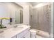 Bathroom showcasing a sink, toilet and a glass shower with gray tile at 12295 Skyracer Dr, Las Vegas, NV 89138