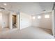 Bright bedroom with neutral carpet, a hallway closet, and an ensuite bathroom with tiled shower at 12295 Skyracer Dr, Las Vegas, NV 89138
