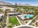 Aerial view of community amenities including pool, lounge areas, and well-manicured landscaping at 12295 Skyracer Dr, Las Vegas, NV 89138
