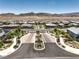 Striking entrance to a planned community with beautiful desert landscaping with mountain views at 12295 Skyracer Dr, Las Vegas, NV 89138