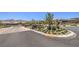 Beautiful gated community entrance with desert landscaping and mountain views beyond at 12295 Skyracer Dr, Las Vegas, NV 89138