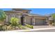 Charming single-story home with a two-car garage and desert landscaping at 12295 Skyracer Dr, Las Vegas, NV 89138