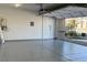 Spacious garage featuring epoxy flooring and an automatic door opener at 12295 Skyracer Dr, Las Vegas, NV 89138