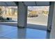 View from the garage of the desert neighborhood and mountains in the distance at 12295 Skyracer Dr, Las Vegas, NV 89138
