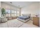 A large main bedroom featuring big windows, a large rug and contemporary decor at 12295 Skyracer Dr, Las Vegas, NV 89138