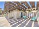 Outdoor lounge featuring a shower and comfortable seating under a shaded pergola at 12295 Skyracer Dr, Las Vegas, NV 89138