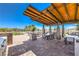 Outdoor seating area with tables, chairs, grill, and nice landscaping at 12295 Skyracer Dr, Las Vegas, NV 89138