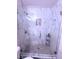 Modern bathroom showcasing glass shower door, tiled walls, and convenient storage niches at 1320 Driscoll Dr # 201, Las Vegas, NV 89128