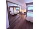Cozy bedroom featuring a four-poster bed with a mirrored closet at 1320 Driscoll Dr # 201, Las Vegas, NV 89128
