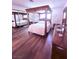 Comfortable bedroom with a decorative four-poster bed and wood flooring at 1320 Driscoll Dr # 201, Las Vegas, NV 89128