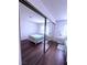 Well-lit bedroom with a white iron bed frame and wood flooring at 1320 Driscoll Dr # 201, Las Vegas, NV 89128