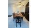 Dining room featuring tile floors, a classic wood table, and a ceiling fan at 1320 Driscoll Dr # 201, Las Vegas, NV 89128