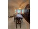 Inviting dining area featuring a classic dining set, a built-in hutch, and a ceiling fan at 1320 Driscoll Dr # 201, Las Vegas, NV 89128