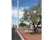 Dog park with benches and trees, located near residential buildings at 1320 Driscoll Dr # 201, Las Vegas, NV 89128