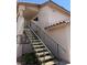 Exterior view of a residential building with a staircase leading to the upper units at 1320 Driscoll Dr # 201, Las Vegas, NV 89128