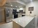 Updated kitchen featuring stainless steel appliances, ample countertop space, and modern cabinetry at 1320 Driscoll Dr # 201, Las Vegas, NV 89128