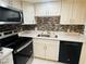 Well-lit kitchen featuring modern appliances, sleek countertops, and stylish backsplash at 1320 Driscoll Dr # 201, Las Vegas, NV 89128