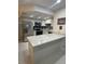 Bright kitchen features stainless steel appliances, light countertops, and tile backsplash at 1320 Driscoll Dr # 201, Las Vegas, NV 89128