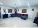 Comfortable living room with sectional sofa and tile flooring at 1320 Driscoll Dr # 201, Las Vegas, NV 89128
