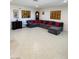Spacious living room featuring a large sectional sofa with tiled floors at 1320 Driscoll Dr # 201, Las Vegas, NV 89128