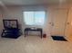 Cozy living room featuring a bright window, TV, and stylish decor at 1320 Driscoll Dr # 201, Las Vegas, NV 89128