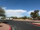 Parking lot in front of a grassy area with trees and RV parking available at 1320 Driscoll Dr # 201, Las Vegas, NV 89128