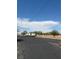 RV parking lot with visible powerlines, mature trees, and clear blue sky at 1320 Driscoll Dr # 201, Las Vegas, NV 89128