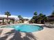 Community pool surrounded by palm trees and well-maintained landscaping offering a resort-like feel at 1320 Driscoll Dr # 201, Las Vegas, NV 89128