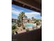 Exterior view of the community pool area surrounded by palm trees and lush landscaping at 1320 Driscoll Dr # 201, Las Vegas, NV 89128