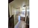 Bathroom with decorative wood partition, single sink vanity, and vintage tile floors at 1400 Silver Peak Ave, Pahrump, NV 89048
