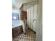 Bathroom with single sink vanity, decorative wood partition, and a toilet at 1400 Silver Peak Ave, Pahrump, NV 89048
