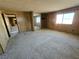 Bedroom with a mirrored closet and window, featuring wood-paneled walls at 1400 Silver Peak Ave, Pahrump, NV 89048