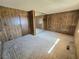 Spacious bedroom with wood-paneled walls and ample closet space, ready for personalization and renovation at 1400 Silver Peak Ave, Pahrump, NV 89048