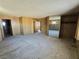 Large bedroom features an open layout with mirrored closet and wood paneled walls at 1400 Silver Peak Ave, Pahrump, NV 89048