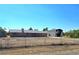 Ranch-style home with brick exterior, large lot and separate outbuilding, plus mature landscaping at 1400 Silver Peak Ave, Pahrump, NV 89048