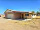 Single car attached garage with brick and siding exterior, plus a large lot at 1400 Silver Peak Ave, Pahrump, NV 89048