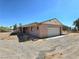 Single car attached garage with brick and siding exterior, plus a large lot at 1400 Silver Peak Ave, Pahrump, NV 89048