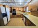 Kitchen featuring white appliances, oak cabinetry and retro flooring at 1400 Silver Peak Ave, Pahrump, NV 89048