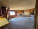 Spacious living room with wood paneling and brick fireplace at 1400 Silver Peak Ave, Pahrump, NV 89048