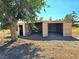 Shed with an open garage door, providing versatile storage or workspace on the property at 1400 Silver Peak Ave, Pahrump, NV 89048