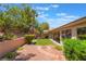 Backyard featuring low maintenance artificial turf, mature trees and shrubbery at 1789 Castro Hill Ave, Henderson, NV 89012