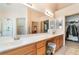Spacious bathroom boasts double sinks, walk-in closet, and bright vanity lighting at 1789 Castro Hill Ave, Henderson, NV 89012