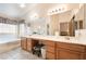 Bright bathroom features double vanity, large mirror, soaking tub, and lots of natural light at 1789 Castro Hill Ave, Henderson, NV 89012