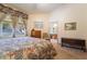 Inviting bedroom with backyard views, soft lighting, and neutral color scheme at 1789 Castro Hill Ave, Henderson, NV 89012