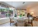 Charming dining area features backyard views, comfortable seating, and natural light at 1789 Castro Hill Ave, Henderson, NV 89012