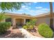 Inviting entryway with stone accents, well-maintained desert landscaping and decorative front door at 1789 Castro Hill Ave, Henderson, NV 89012