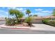 Charming single-story home featuring a well-maintained yard and desert landscaping with palm trees at 1789 Castro Hill Ave, Henderson, NV 89012