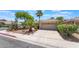 Charming single-story home featuring a well-maintained yard, desert landscaping and two-car garage at 1789 Castro Hill Ave, Henderson, NV 89012
