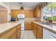 Spacious kitchen featuring a breakfast bar, modern appliances, and backyard view at 1789 Castro Hill Ave, Henderson, NV 89012